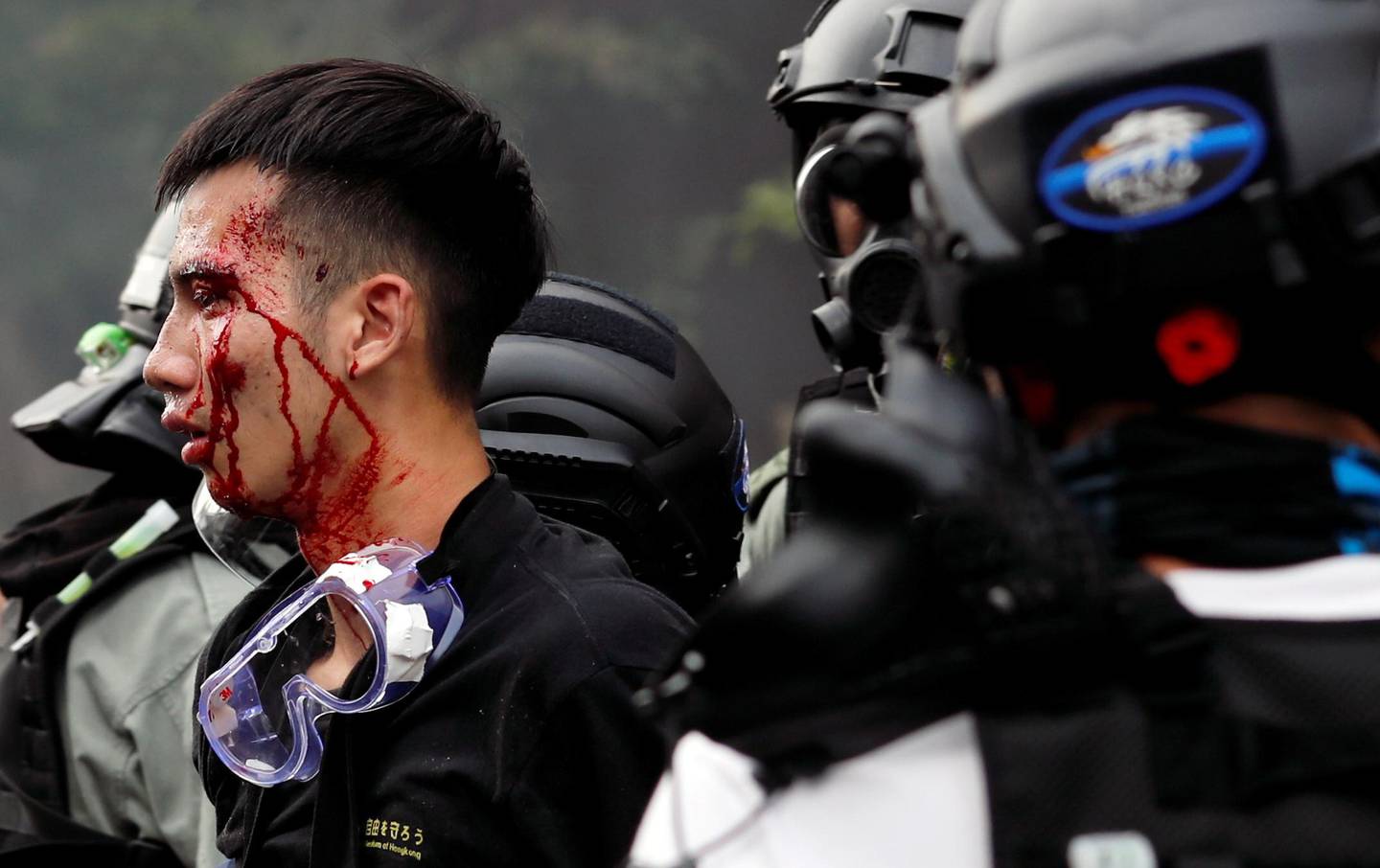 SENSITIVE MATERIAL. THIS IMAGE MAY OFFEND OR DISTURB    Police detain protesters who attempt to leave the campus of Hong Kong Polytechnic University (PolyU) during clashes with police in Hong Kong, China November 18, 2019. REUTERS/Tyrone Siu     TPX IMAGES OF THE DAY