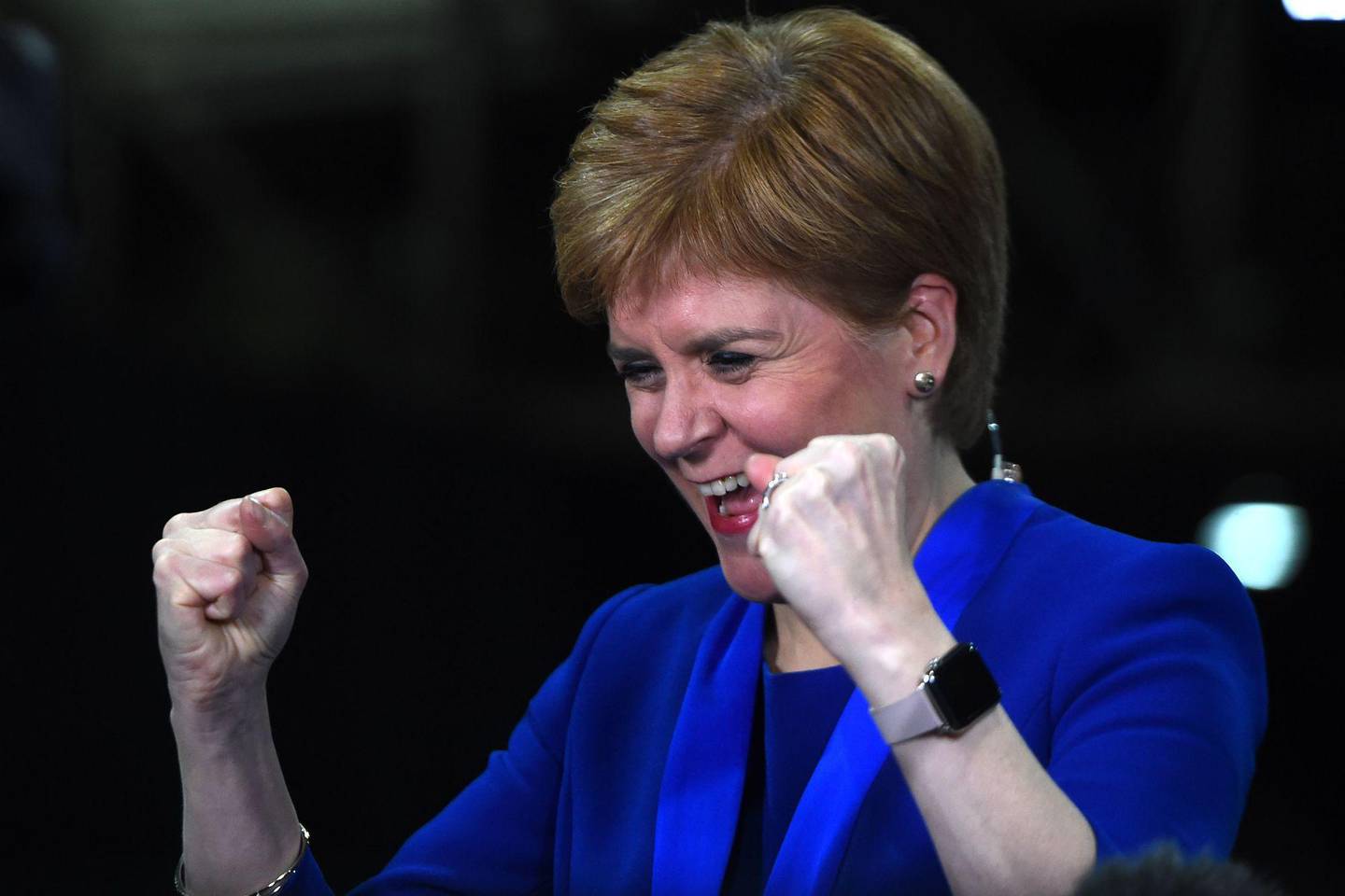 Scottish National Party (SNP) leader and Scotland's First Minister Nicola Sturgeon celebrates as she hears that New Scottish National Party (SNP) MP for Dunbartonshire East, Amy Callaghan has unseated Britain's Liberal Democrat leader Jo Swinson, at the count centre in Glasgow on December 13, 2019 after votes are counted in the UK general election. (Photo by ANDY BUCHANAN / AFP)
