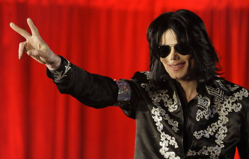 FILE - In this March 5, 2009, file photo, Michael Jackson appears at an event to announce a series of concerts in London. Forbes announced on Oct. 30, 2017, that Jackson topped its list of highest-earning dead celebrities. (AP Photo/Joel Ryan, File)