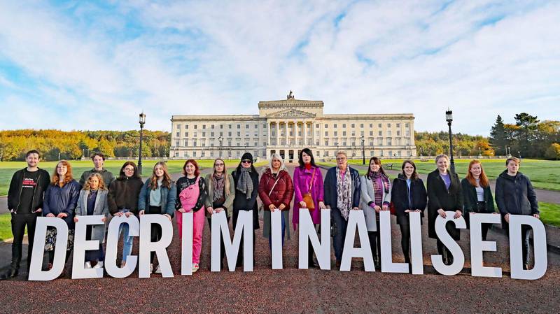 Pro-choice activists take part in a photo call in the grounds of Stormont Parliament, Belfast, Monday Oct. 21, 2019. Abortion is set to be decriminalized and same-sex marriage legalized in Northern Ireland as of midnight, bringing its laws in line with the rest of the U.K. (Niall Carson/PA via AP)