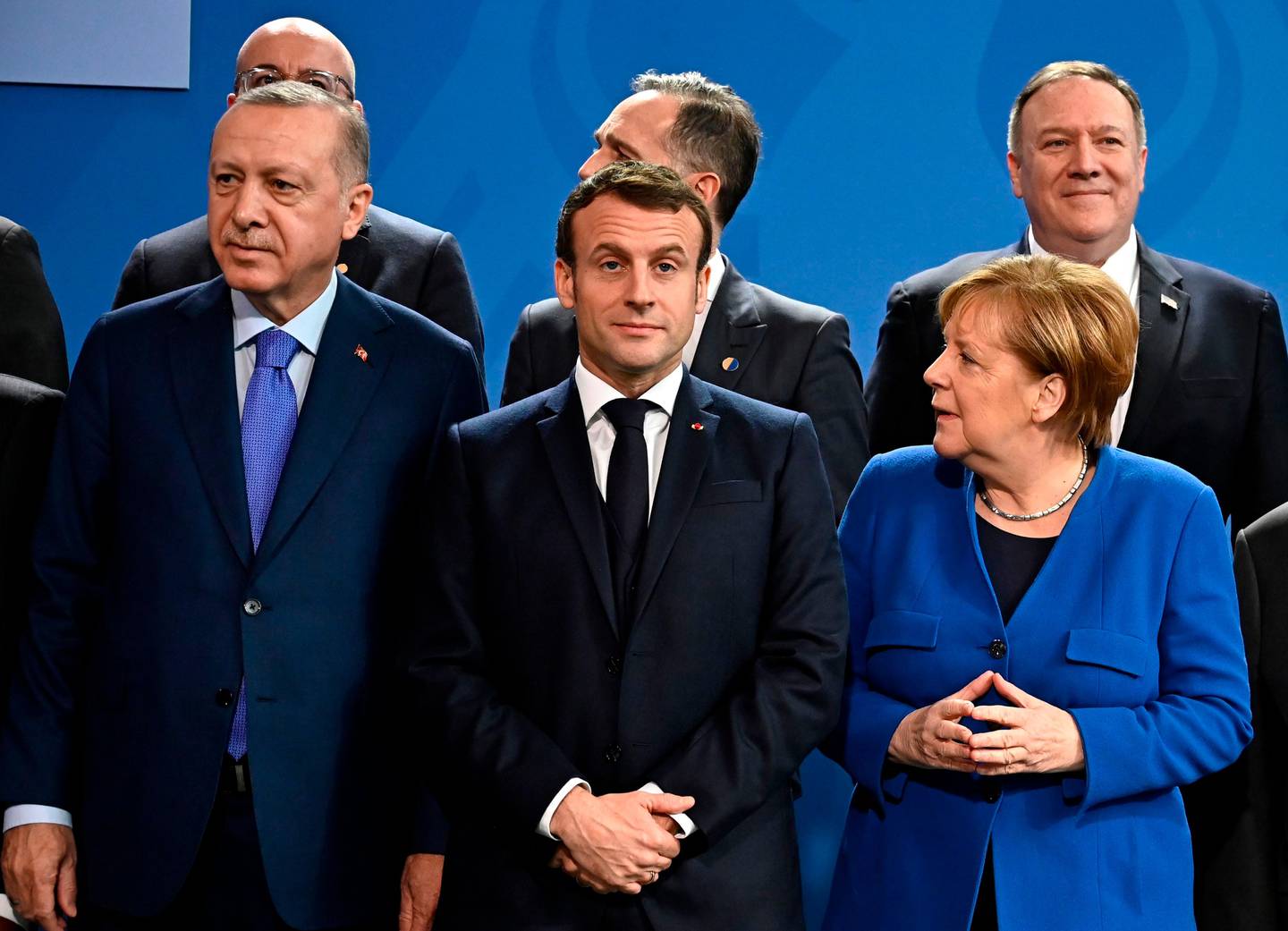 (Front row, L to R) Turkish President Recep Tayyip Erdogan, French President Emmanuel Macron, German Chancellor Angela Merkel, (second row, L to R) European Council President Charles Michel, German Foreign Minister Heiko Maas and US Secretary of State Mike Pompeo pose for a family picture during a Peace summit on Libya at the Chancellery in Berlin, on January 19, 2020. - World leaders gather in Berlin on January 19, 2020 to make a fresh push for peace in Libya, in a desperate bid to stop the conflict-wracked nation from turning into a "second Syria". Chancellor Angela Merkel will be joined by the presidents of Russia, Turkey and France and other world leaders for talks held under the auspices of the United Nations. (Photo by Tobias SCHWARZ / AFP)