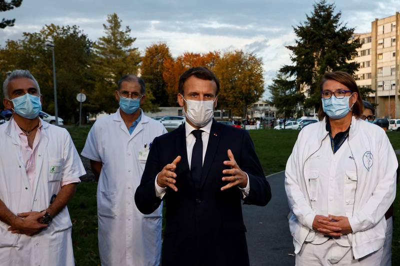 French President Emmanuel Macron speaks to the press after chairing a meeting with the medical staff of the Rene Dubos hospital center, in Pontoise, in the Val d'Oise, on October 23, 2020, as the country faces a new wave of infections to the Covid-19 (the novel coronavirus). (Photo by Ludovic MARIN / various sources / AFP)