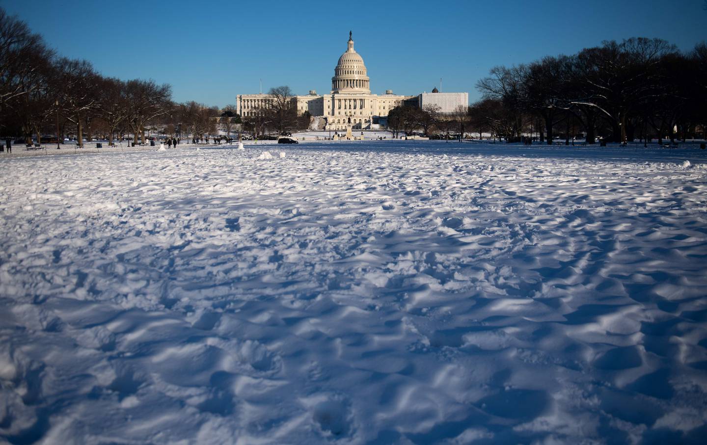 The US Capitol in Washington, DC, January 14, 2019, is seen following a snowstorm. (Photo by SAUL LOEB / AFP)