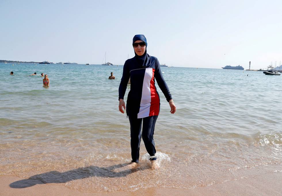 FILE PHOTO: 70th Cannes Film Festival - Cannes, France. 27/05/2017. Karima, wearing a full-body burkini swimsuit, walks on a beach in Cannes after the call to support the wearing of burkinis by businessman and political activist Rachid Nekkaz.  REUTERS/Eric Gaillard/File Photo