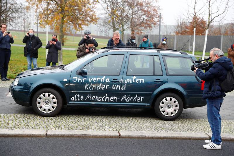 Media films and photograph the car which crashed into the gate of the main entrance of the chancellery in Berlin, the office of German Chancellor Angela Merkel in Berlin, Germany, November 25, 2020. REUTERS/Fabrizio Bensch