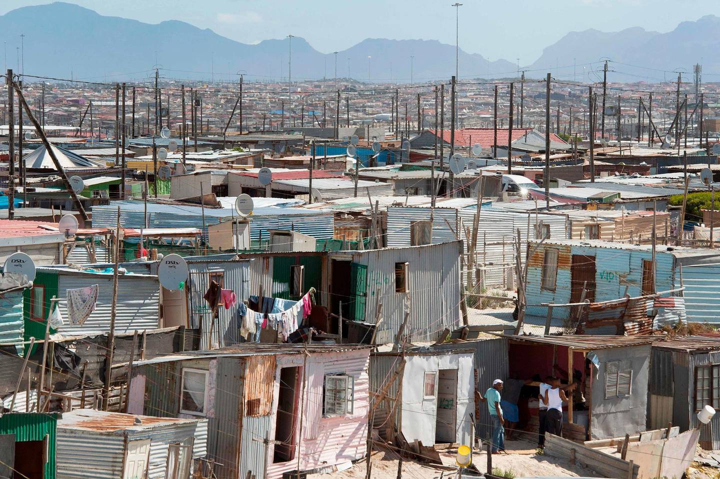 A general view of Khayelitsha, near Cape Town, on March 31, 2020. - Local government administrators in Cape Town said on March 29, 2020, a COVID-19 coronavirus case had been detected in Khayelitsha, the city's largest township, where hundreds of thousands live in shacks. 
An outbreak in the crowded townships where water and sanitation are problematic, could prove difficult to contain in the country which already has the highest number of infections in Africa. (Photo by RODGER BOSCH / AFP)