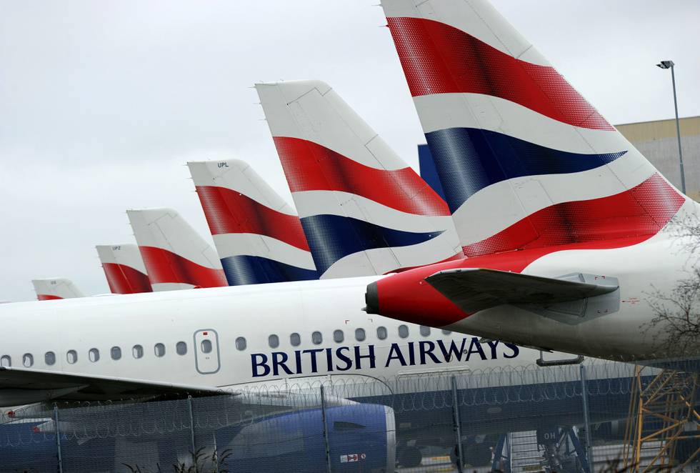 This file picture taken on March 29, 2010 shows British Airways aircraft sitting parked at London Heathrow Airport during the third day of a four-day strike. - A strike by nearly 850 employees of the cargo division of the airline British Airways protesting their pay conditions is set to start on Christmas Day and last for 9 days, according to the union Unite. (Photo by Adrian DENNIS / AFP)