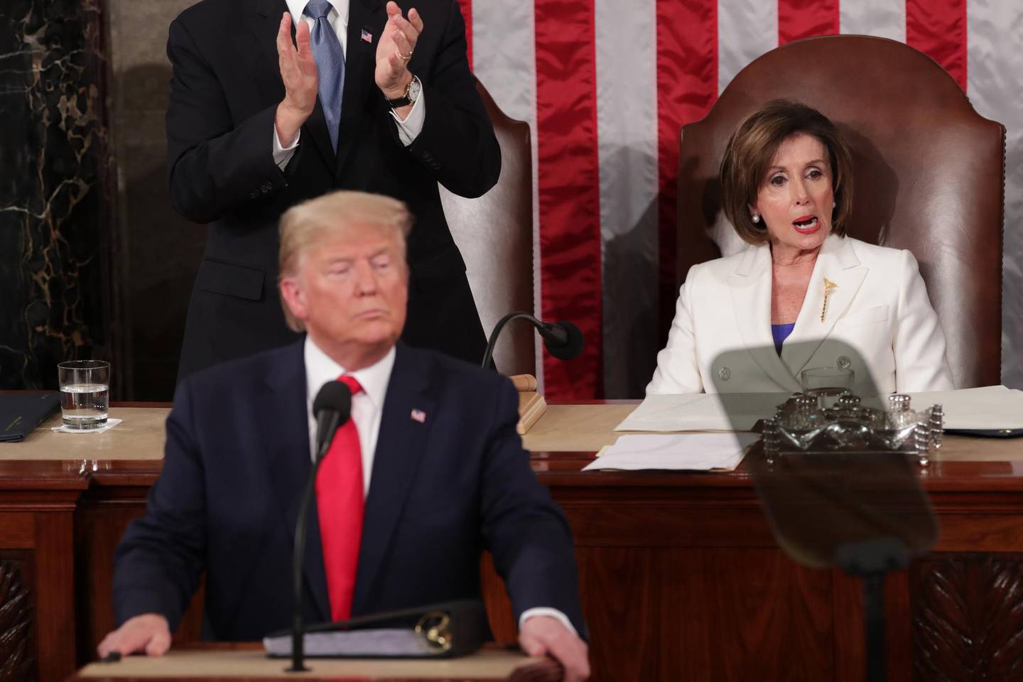U.S. President Donald Trump speaks near Speaker of the House Nancy Pelosi (D-CA) during his State of the Union address to a joint session of the U.S. Congress in the House Chamber of the U.S. Capitol in Washington, U.S. February 4, 2020. REUTERS/Jonathan Ernst