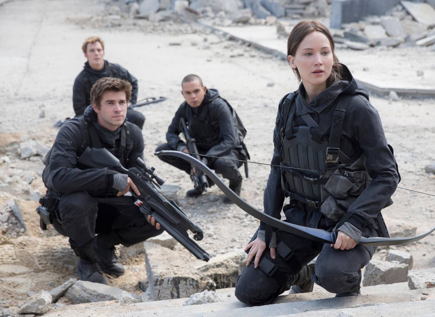 This photo provided by Lionsgate shows, Liam Hemsworth, left, as Gale Hawthorne, Sam Clafin, back left, as Finnick Odair, Evan Ross, back right, as Messalia, and Jennifer Lawrence, right, as Katniss Everdeen, in the film, "The Hunger Games: Mockingjay - Part 2."  Older kids can enjoy Lionsgate films free on its YouTube channel, with the dystopian films The Hunger Games.  (Murray Close/Lionsgate via AP)