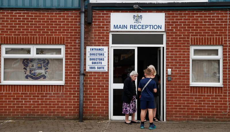 A general view of the directors entrance at Gigg Lane stadium, home of Bury Football Club, in Bury, England, Tuesday, Aug. 27, 2019. Bury FC are almost certain to be expelled from the third tier of English soccer after a proposed takeover by C&N Sporting Risk fell through on Tuesday, just 90 minutes before a league-set deadline for the deal to be completed. The League One club's owner Steve Dale was originally given until midnight on Friday to prove he could pay off Bury's debts and fund the next two seasons or find someone who could. (AP Photo/Alastair Grant)