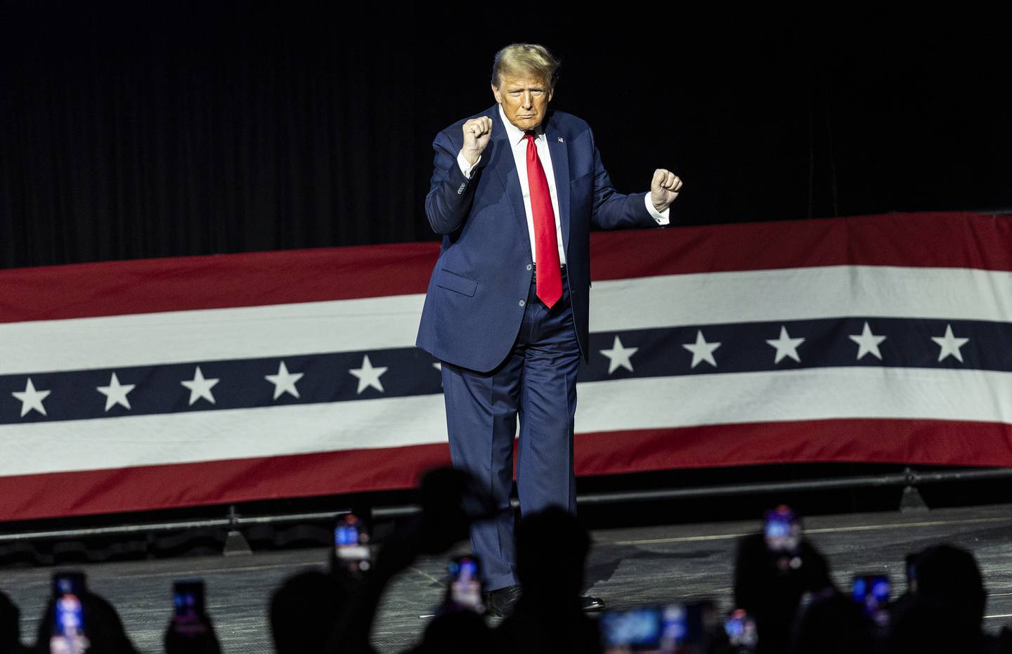 Republican presidential candidate former President Donald Trump gestures to the crowd at the NRA’s Great American Outdoor Show, Friday, Feb. 9, 2024, in Harrisburg, Pa. (Sean Simmers/The Patriot-News via AP)