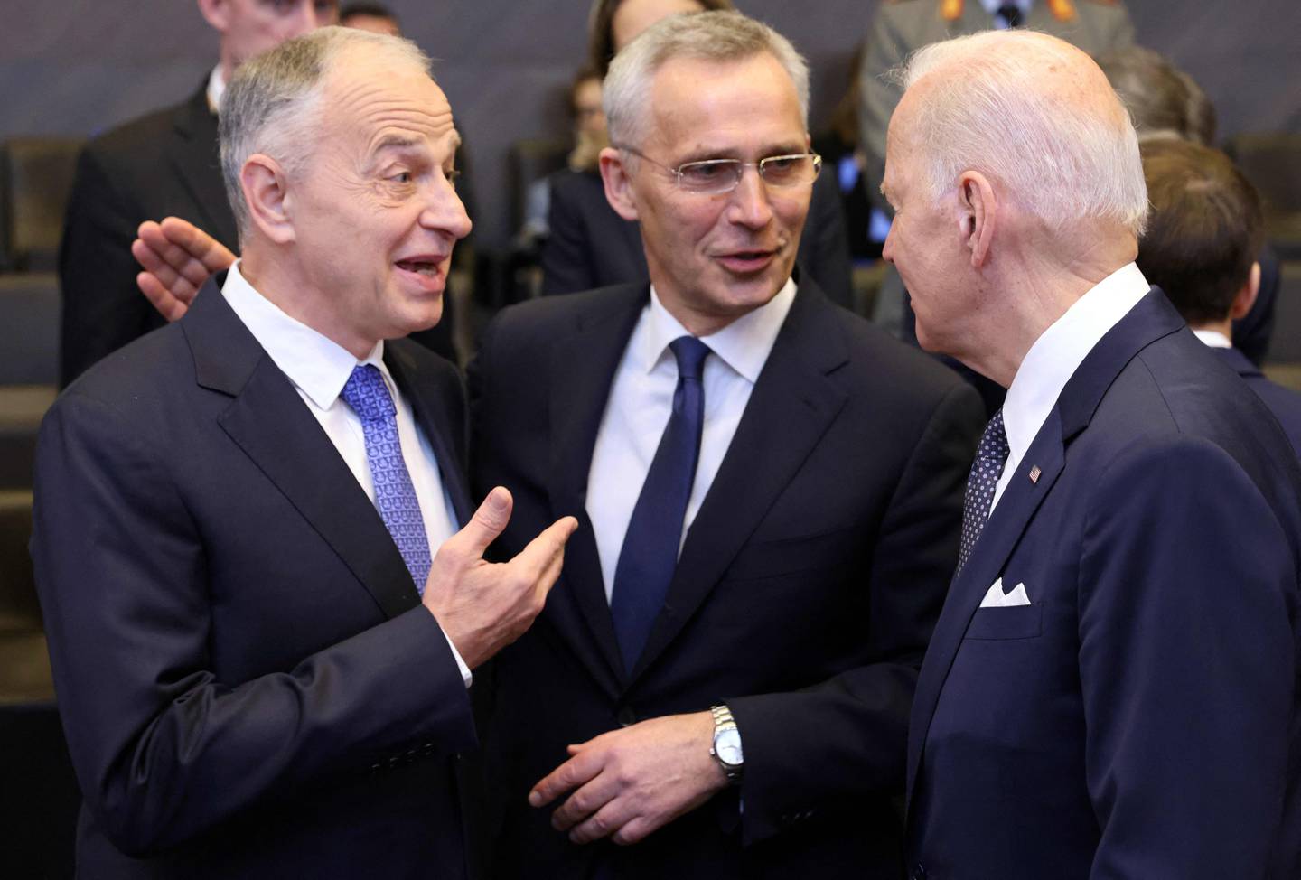 (L/R): NATO deputy Secretary General Mircea Geoana, NATO Secretary General Jens Stoltenberg and US President Joe Biden speak ahead of a meeting of The North Atlantic Council at NATO Headquarters in Brussels on March 24, 2022. (Photo by Thomas COEX / AFP)
