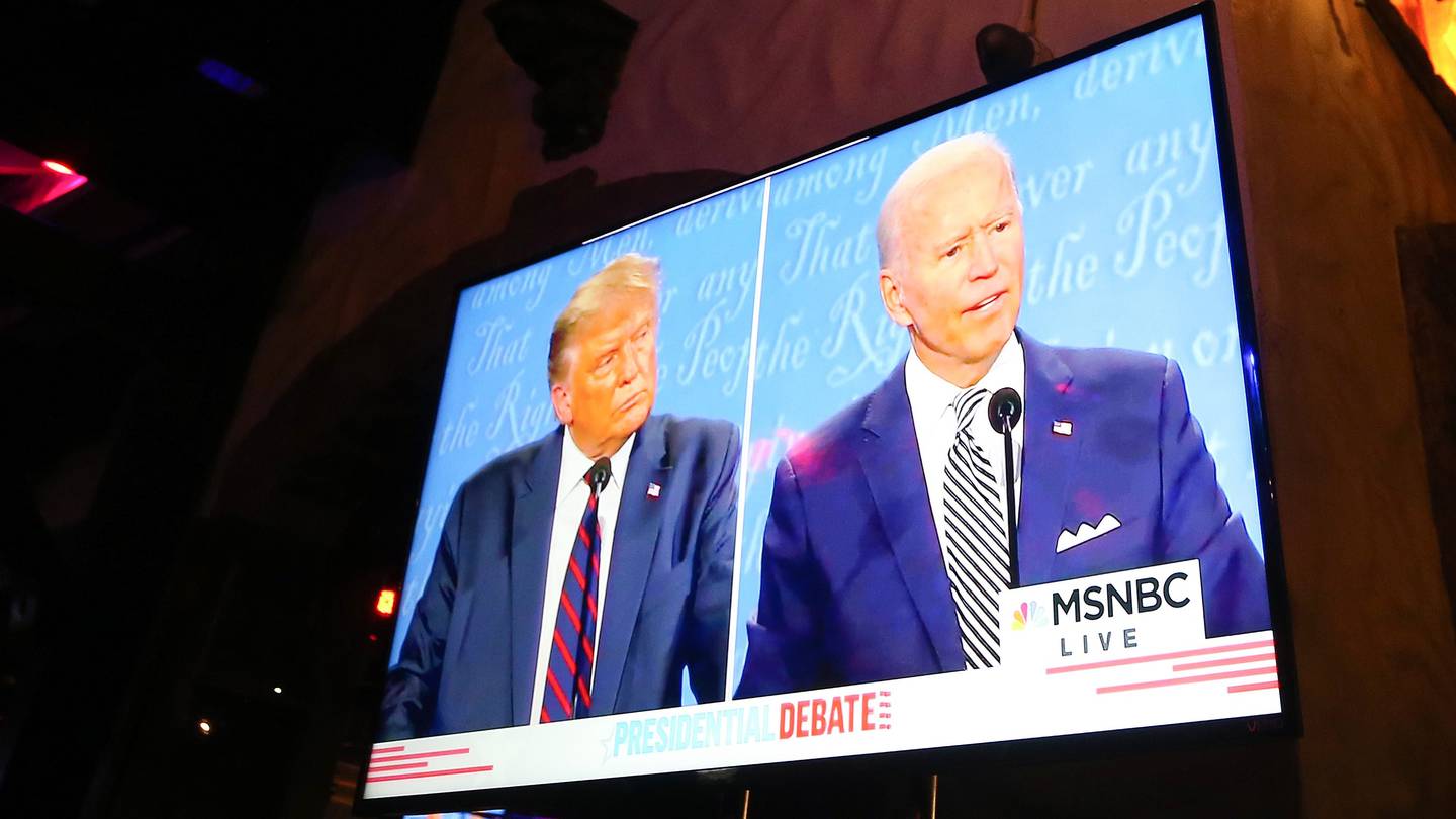 WEST HOLLYWOOD, CALIFORNIA - SEPTEMBER 29: A broadcast of the first debate between President Donald Trump and Democratic presidential nominee Joe Biden is played on a TV at The Abbey, which seated patrons at socially distanced outdoor tables, on September 29, 2020 in West Hollywood, California. The debate being held in Cleveland, Ohio is the first of three scheduled debates between Trump and Biden.   Mario Tama/Getty Images/AFP