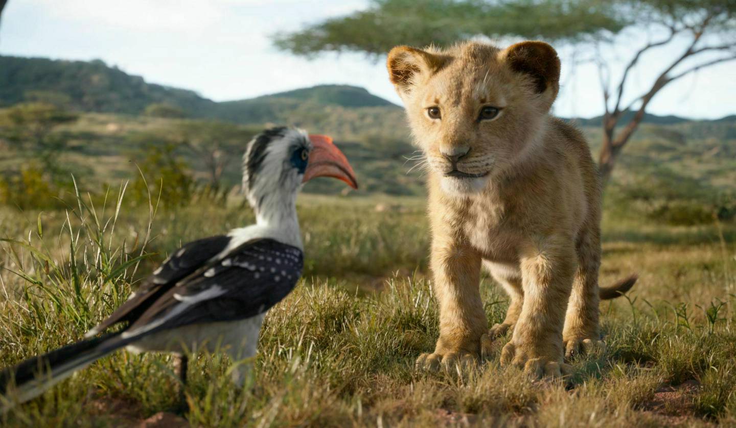 This image released by Disney shows characters, from left, Zazu, voiced by John Oliver, and young Simba, voiced by JD McCrary, in a scene from "The Lion King."  (Disney via AP)