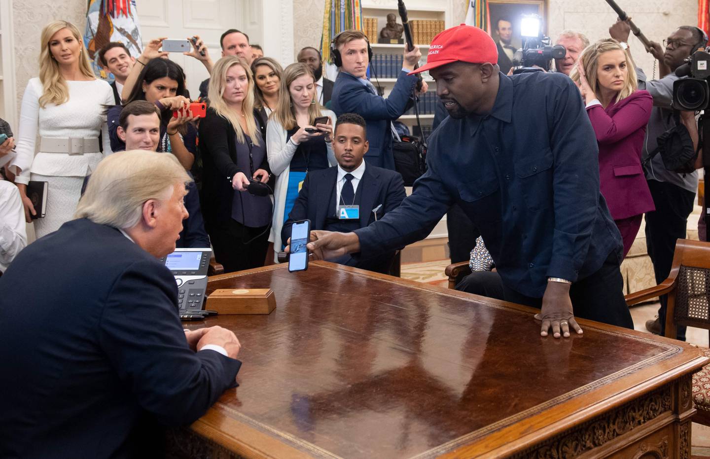 US President Donald Trump meets with rapper Kanye West (R) in the Oval Office of the White House in Washington, DC, on October 11, 2018. (Photo by SAUL LOEB / AFP)