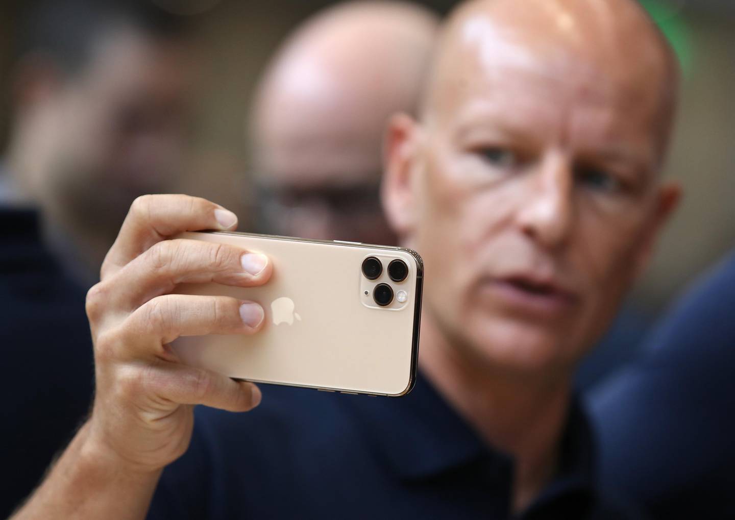 CUPERTINO, CALIFORNIA - SEPTEMBER 10: An attendee look at the new Apple iPhone 11 Pro during an Apple special event on September 10, 2019 in Cupertino, California. Apple unveiled several new products including an iPhone 11, iPhone 11 Pro, Apple Watch Series 5 and an updated iPad.   Justin Sullivan/Getty Images/AFP
== FOR NEWSPAPERS, INTERNET, TELCOS & TELEVISION USE ONLY ==