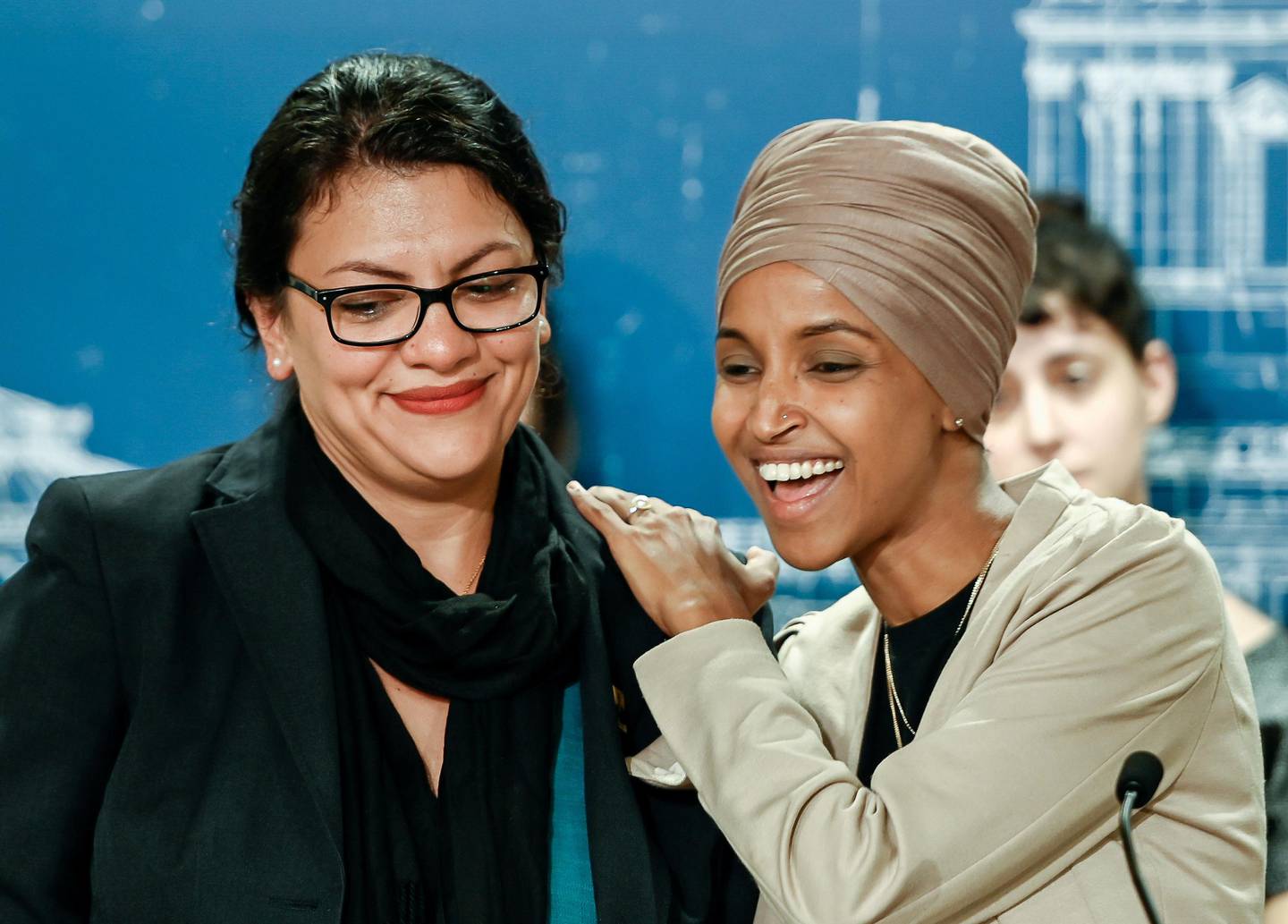 U.S. Representatives Rashida Tlaib (D-MI) and Ilhan Omar (D-MN) react as they discuss travel restrictions to Palestine and Israel during a news conference at the Minnesota State Capitol Building in St Paul, Minnesota, August 19, 2019.    REUTERS/Caroline Yang     TPX IMAGES OF THE DAY
