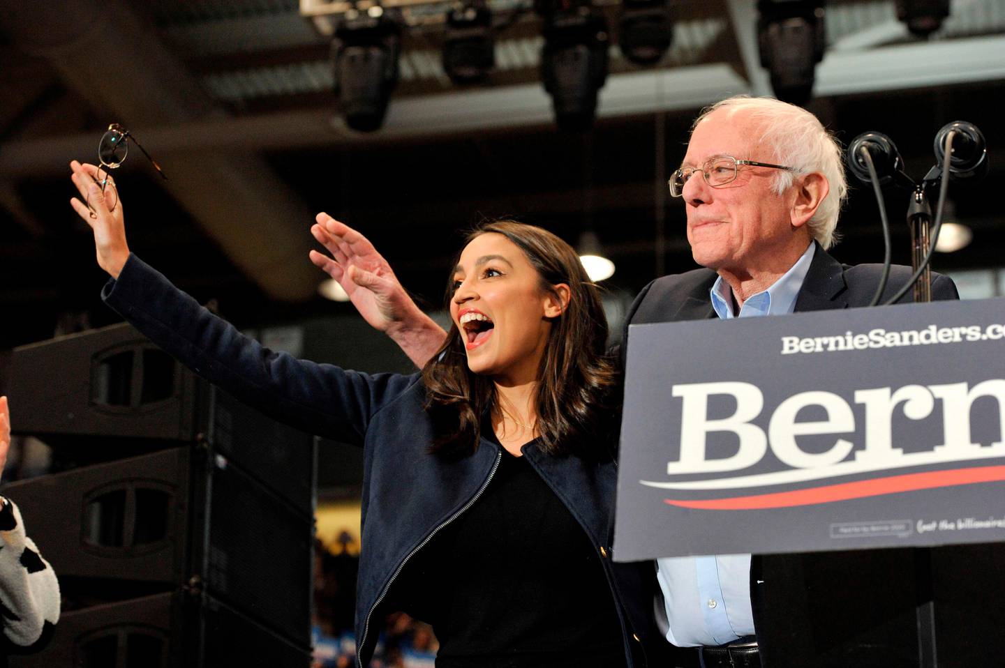 (FILES) In this file photo taken on February 10, 2020 Congresswoman Alexandria Ocasio-Cortez and Presidential Candidate Vermont Senator Bernie Sanders wave to his supporters at rally at the University of New Hampshire in Durham, New Hampshire. - Two years after Alexandria Ocasio-Cortez stunned the US political establishment by winning a seat in Congress and becoming one of its best-known members, another upstart New Yorker is gaining attention, one of several likely electoral wins galvanizing the Democratic left ahead of November. (Photo by Joseph Prezioso / AFP)