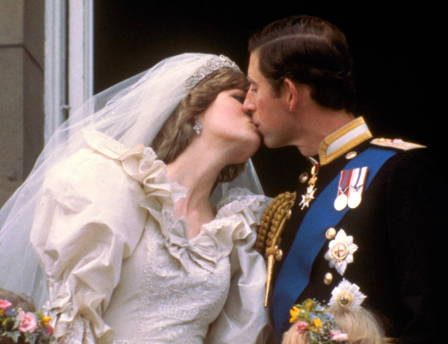FILE - This is July 29, 1981 file photo of Britain's Prince Charles kisses his bride, Princess Diana , on the balcony of Buckingham Palace in London, after their wedding. FX has announced a 10-episode series that will spotlight the doomed royal couple Charles and Diana. It is scheduled to air in 2018. No cast members were disclosed by the network. (AP Photo, File )