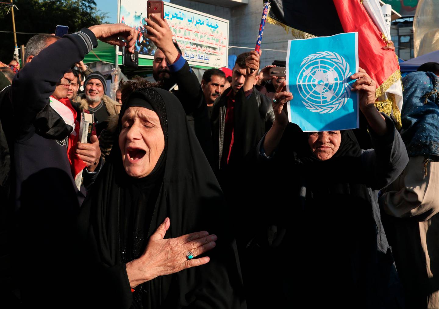Anti-government protesters chant slogans against the Iraqi government during ongoing demonstrations in Baghdad, Iraq, Friday, Jan. 31, 2020. (AP Photo/Hadi Mizban)