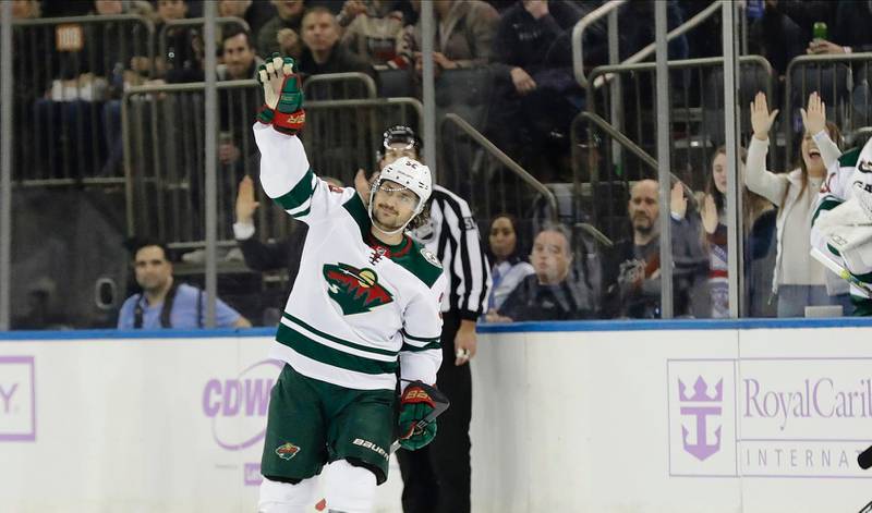 Minnesota Wild's Mats Zuccarello waves to fans after a video tribute to him during the first period of an NHL hockey game against the New York Rangers Monday, Nov. 25, 2019, in New York. (AP Photo/Frank Franklin II)