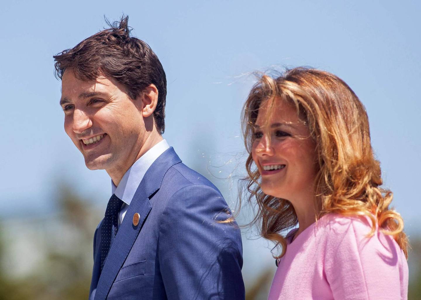 (FILES) In this file photo taken on June 08, 2018 Prime Minister of Canada Justin Trudeau and his wife Sophie Gregoire Trudeau arrive for a welcome ceremony for G7 leaders on the first day of the summit in La Malbaie, Quebec, Canada. - Some celebrities around the world are affected by the novel coronavirus. Canadian Prime Minister Justin Trudeau has been in quarantaine since March 13, 2020 and for two weeks, as his wife Sophie Gregoire Trudeau was tested positive. (Photo by GEOFF ROBINS / AFP)