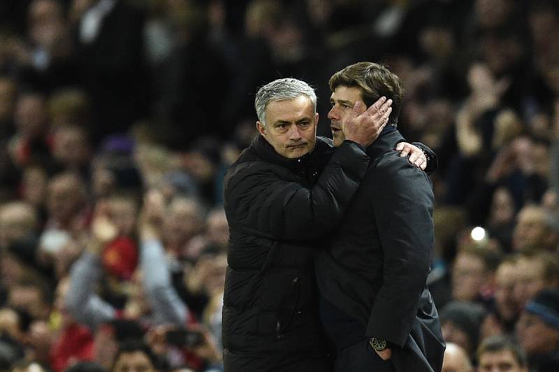 (FILES) In this file photo taken on December 11, 2016 Tottenham Hotspur's Argentinian head coach Mauricio Pochettino (R) is embraced by Manchester United's Portuguese manager Jose Mourinho after the English Premier League football match between Manchester United and Tottenham Hotspur at Old Trafford in Manchester, north west England. - Jose Mourinho, one of European football's most successful managers, was appointed on November 20, 2019 to replace the sacked Mauricio Pochettino at Tottenham, with a brief to revive the fortunes of a club languishing in the lower reaches of the Premier League. (Photo by Oli SCARFF / AFP) / RESTRICTED TO EDITORIAL USE. No use with unauthorized audio, video, data, fixture lists, club/league logos or 'live' services. Online in-match use limited to 75 images, no video emulation. No use in betting, games or single club/league/player publications. / 