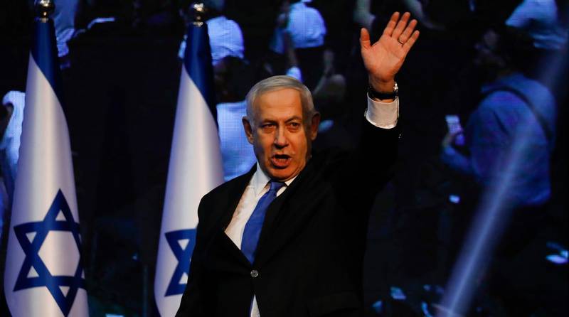 Israeli Prime Minister Benjamin Netanyahu addressees his supporters at party headquarters after elections in Tel Aviv, Israel, Wednesday, Sept. 18, 2019. (AP Photo/Ariel Schalit)