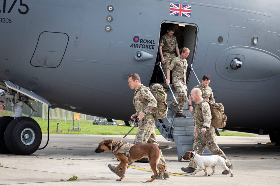 Military personnel and military dogs arrive at RAF Brize Norton base after being evacuated from Afghanistan, in Oxfordshire, Britain August 29, 2021. SAC Samantha Holden RAF/UK MOD Crown copyright 2021/Handout via REUTERS ATTENTION EDITORS - THIS IMAGE HAS BEEN SUPPLIED BY A THIRD PARTY.