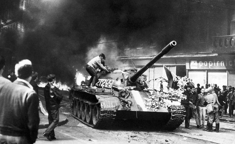 TO GO WITH AFP STORY
(FILES) Picture taken on August 21, 1968 shows a young Prague resident climbing on a Soviet T-54 tank in the Vinohrady street near the state-owned radio building in Prague during confrontations between demonstrators and the Warsaw Pact troops and tanks, who invaded Czechoslovakia to crush the newfound freedom and re-establish a totalitarian regime. The Soviet occupation of Czechoslovakia 1968-1991 caused 402 deaths among the Czechs and Slovaks, according to a report by Czech historians in a "Black Book of Soviet occupation" published on the occasion of 47th birthday invasion.  AFP PHOTO / -