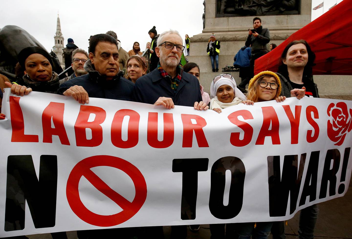 Britain's Labour Party leader Jeremy Corbyn carries a banner as he attends a protest to oppose the threat of war with Iran, in London, Britain January 11, 2020.  REUTERS/Henry Nicholls