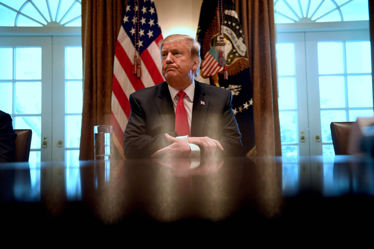 (FILES) In this file photo taken on January 31, 2019 US President Donald Trump meets to discuss fighting human trafficking on the southern border in Washington, DC. - President Donald Trump promises a shift to sunny optimism in the State of the Union speech but with his congressional Democratic nemesis seated right behind him, will he be able to resist throwing his usual thunderbolts? The White House is flagging an "optimistic," "unifying," even "visionary" speech to mark this presidency's midway point. In an excerpt released Friday, Trump predicts Republicans and Democrats can "break decades of political stalemate." But the mood in Washington is as hostile as it has been for years following the confrontation between Trump and the Democratic-led House of Representatives over his demand for funding for a US-Mexico border wall. (Photo by Jim WATSON / AFP)