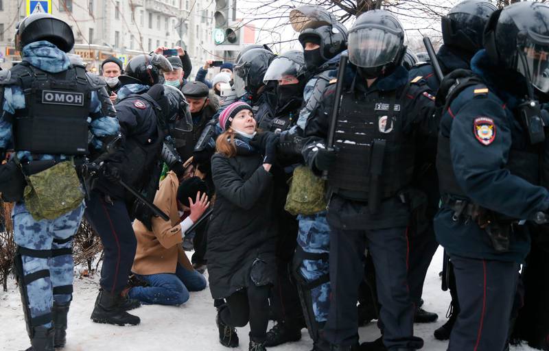 Police detain a man during a protest against the jailing of opposition leader Alexei Navalny in Moscow, Russia, Saturday, Jan. 23, 2021. Russian police on Saturday arrested hundreds of protesters who took to the streets in temperatures as low as minus-50 C (minus-58 F) to demand the release of Alexei Navalny, the country's top opposition figure. A Navalny, President Vladimir Putin's most prominent foe, was arrested on Jan. 17 when he returned to Moscow from Germany, where he had spent five months recovering from a severe nerve-agent poisoning that he blames on the Kremlin. (AP Photo/Alexander Zemlianichenko)