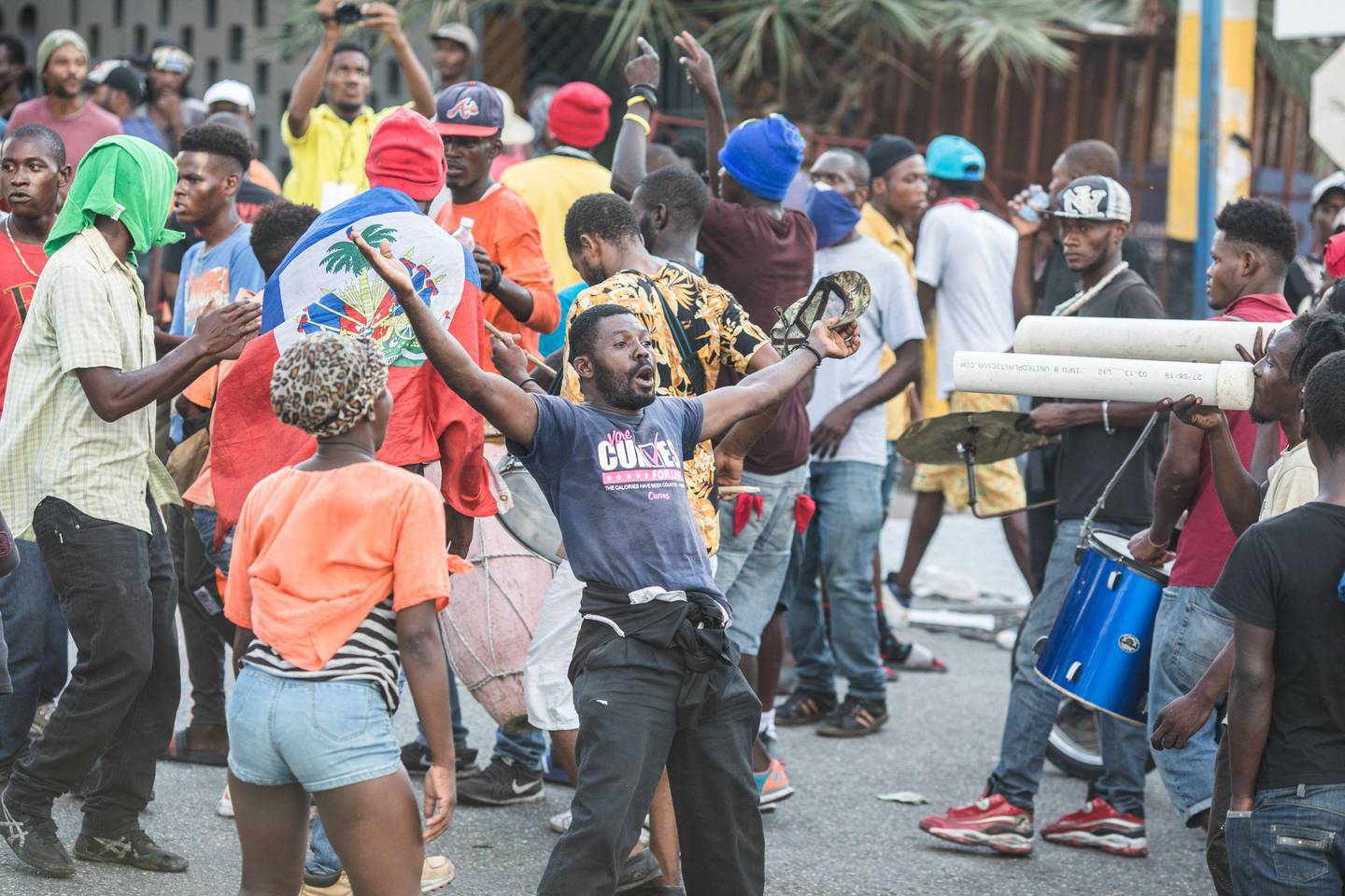 Protesters march to demand the resignation of President Jovenel Moise, in Port-au-Prince, Haiti, on November 10, 2019 after the opponents to the President reached an agreement for a political transition. (Photo by Valerie Baeriswyl / AFP)
