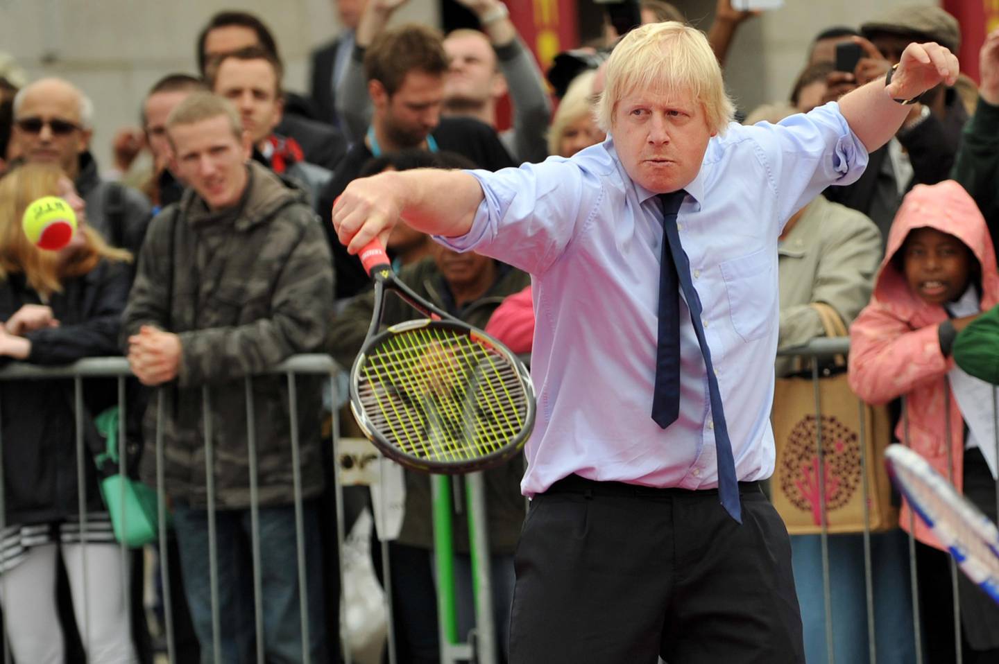 (FILES) In this file photo taken on September 08, 2011 Mayor of London, Boris Johnson plays tennis during the International Paralympic Day in Trafalgar Square, central London, on September 8, 2011. - The Conservative Party will announce the result of the leadership ballot on July 23, 2019 with former London mayor and former foreign secretary Boris Johnson widely tipped to win the race to lead the party and take up office at 10 Downing Street. (Photo by Ben STANSALL / AFP)