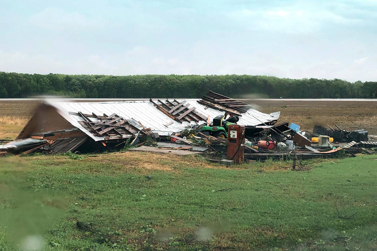 In this image made from video provided by WLBT-TV strong storms pound parts of the Deep South, including this house and shed in Yazoo County, Miss., Sunday, April 12, 2020. Winds damaged buildings and toppled trees throughout Louisiana and Mississippi as they advance to Tennessee and Alabama. (Mike Evans/WLBT-TV, via AP)