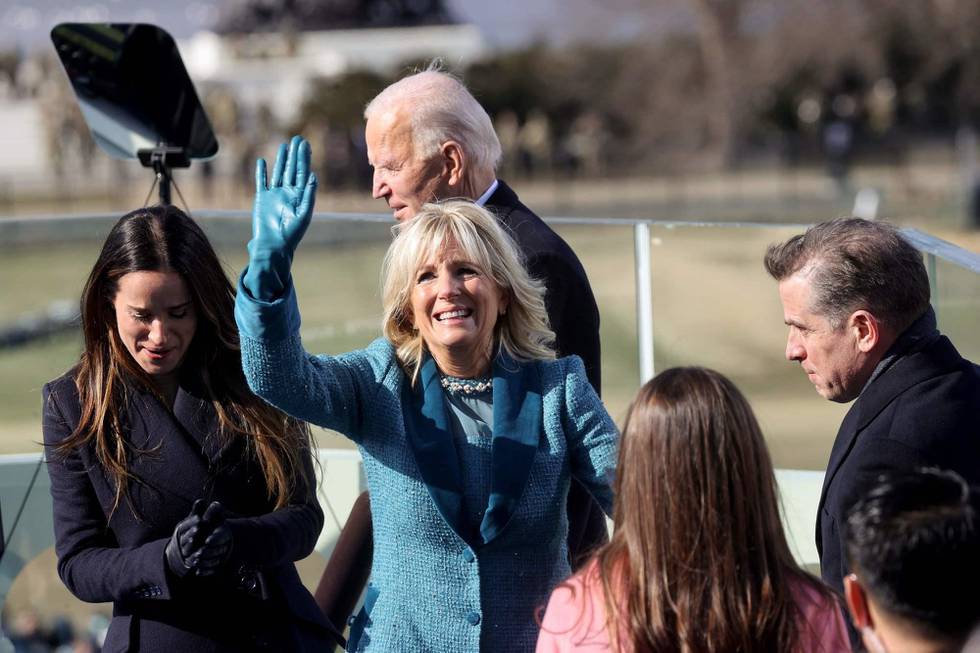 US First Lady Jill Biden (C) waves next to Ashley and Hunter Biden after her husband Joe was sworn in as the 46th US President by Supreme Court Chief Justice John Roberts on January 20, 2021, at the US Capitol in Washington, DC. (Photo by JONATHAN ERNST / POOL / AFP)