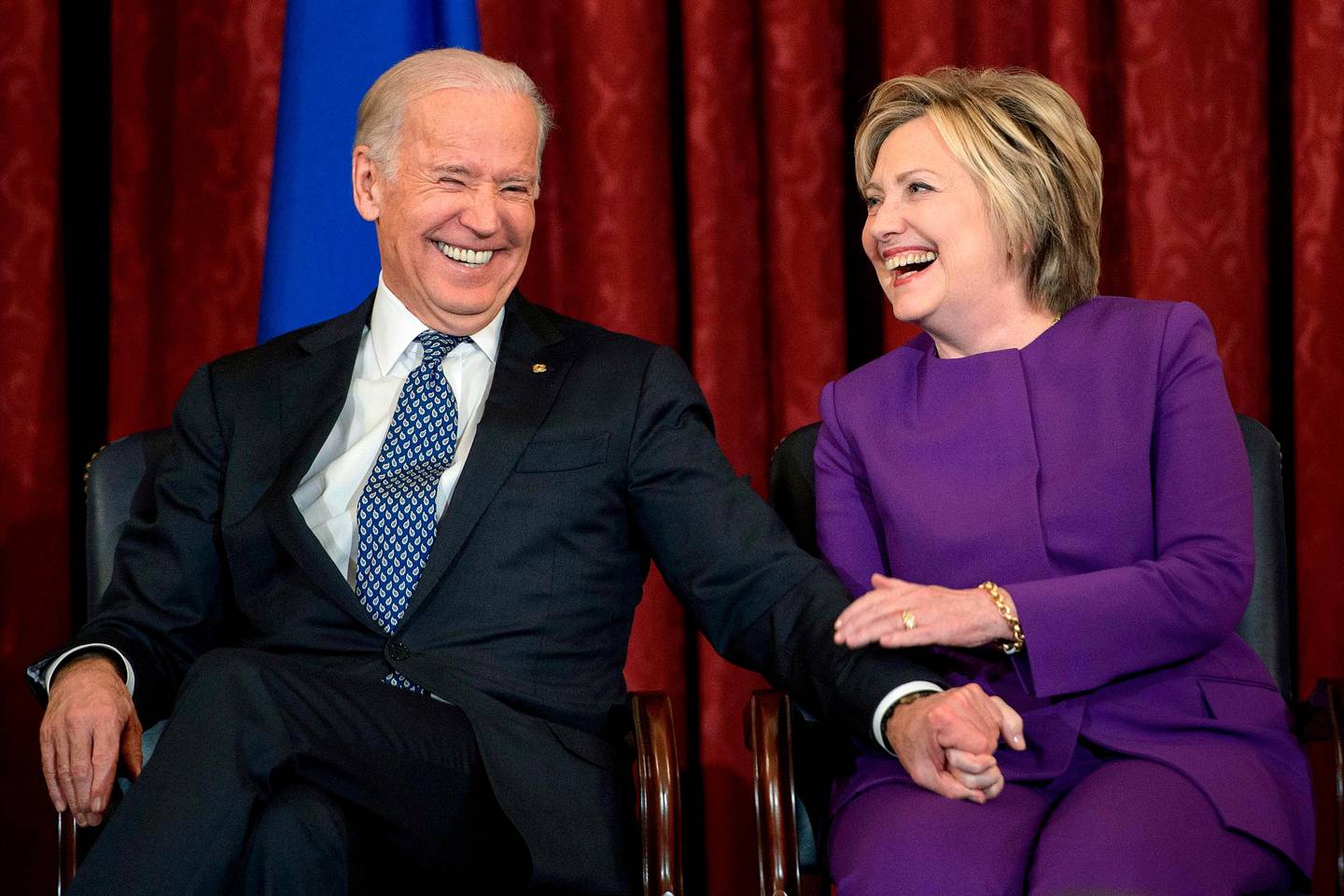 (FILES) In this file photo former US Vice President Joe R. Biden (L) and former Secretary of State Hillary Clinton laugh during a portrait unveiling for outgoing Senate Minority Leader Senator Harry Reid (D-NV) on Capitol Hill December 8, 2016 in Washington, DC. - Former Democratic presidential candidate Hillary Clinton is to hold a video conference with Joe Biden on April 28, 2020 during which she is expected to endorse his White House bid.
Clinton, who headed the Democratic ticket against Republican Donald Trump in 2016, announced on Twitter that she would be the "surprise guest" at a virtual town hall with Biden at 3:00 pm (1900 GMT) to discuss the impact of the coronavirus pandemic on women. (Photo by Brendan Smialowski / AFP)