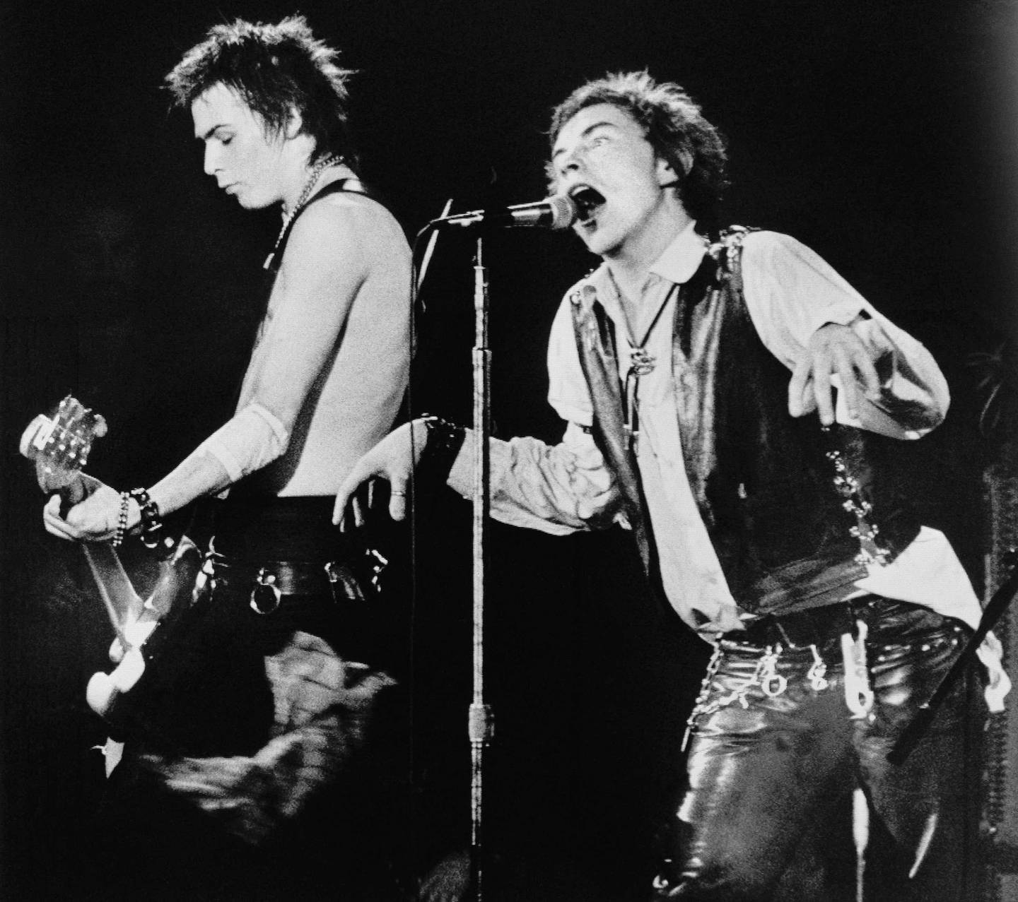 Sid Vicious, left, on base guitar and Johnny Rotten of the punk rock group The Sex Pistols perform in front of a capacity crowd at San Francisco's Winterland auditorium Saturday night January 15, 1978. This was the Sex Pistols' last stop on their American tour. (AP Photo)