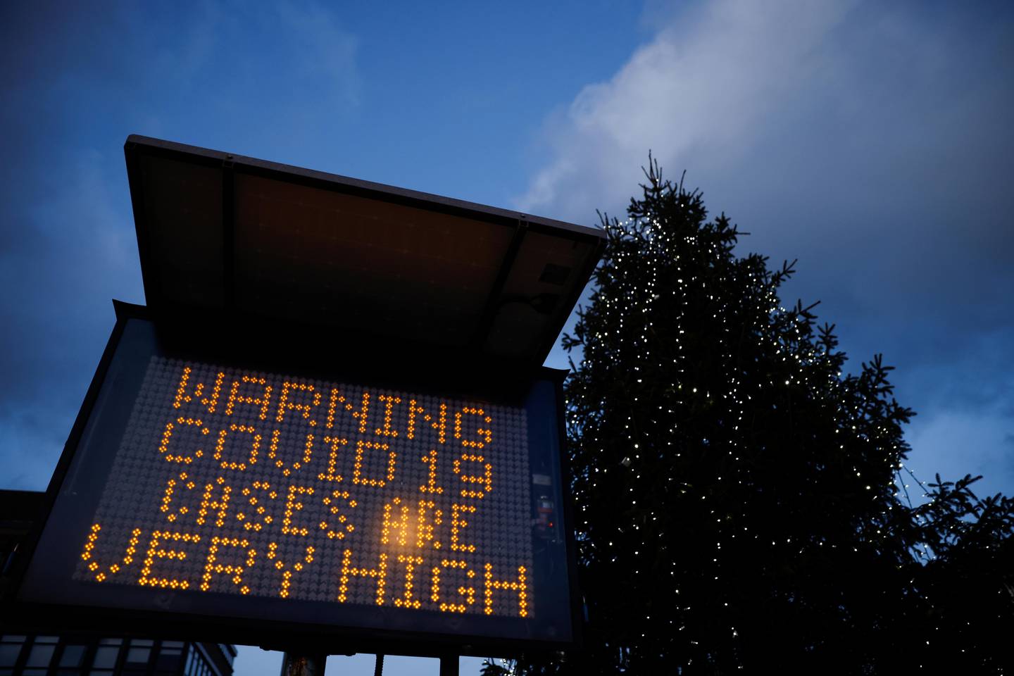 An electronic sign displays information as the British government imposes a stricter tiered set of restrictions amid the coronavirus disease (COVID-19) pandemic, in London, Britain, December 20, 2020. REUTERS/John Sibley