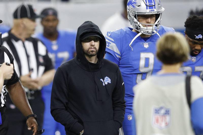 DETROIT, MI - SEPTEMBER 10: Hip-hop artist Eminem takes the field for the coin toss prior to the game between the New York Jets and Detroit Lions at Ford Field on September 10, 2018 in Detroit, Michigan.   Joe Robbins/Getty Images/AFP
== FOR NEWSPAPERS, INTERNET, TELCOS & TELEVISION USE ONLY ==