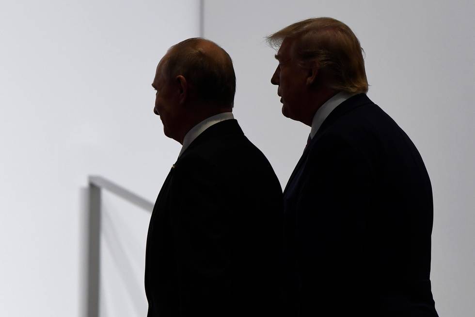 FILE - In this June 28, 2019, file photo, President Donald Trump and Russian President Vladimir Putin walk to participate in a group photo at the G20 summit in Osaka, Japan. The Trump administration is notifying international partners that it is pulling out of a treaty that permits 30-plus nations to conduct unarmed, observation flights over each others territory  overflights set up decades ago to promote trust and avert conflict. The administration says it wants out of the Open Skies Treaty because Russia is violating the pact and imagery collected during the flights can be obtained quickly at less cost from U.S. or commercial satellites. (AP Photo/Susan Walsh, File)