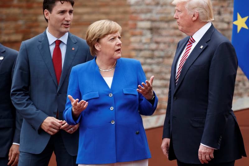 Donald Trump er med for første gang. Her med Angela Merkel og Justin Trudeau.