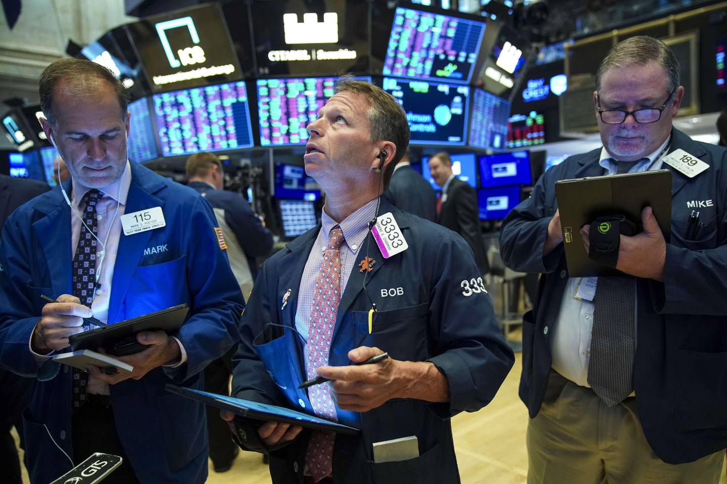 NEW YORK, NY - AUGUST 13: Traders and financial professionals work on the floor of the New York Stock Exchange (NYSE) at the opening bell on August 13, 2019 in New York City. The Dow Jones Industrial Average jumped up 400 points in early trading on Tuesday, led by Apple after the Trump administration said it will delay tariffs on some items, initially set to go into effect on September 1, until December 15.   Drew Angerer/Getty Images/AFP
== FOR NEWSPAPERS, INTERNET, TELCOS & TELEVISION USE ONLY ==