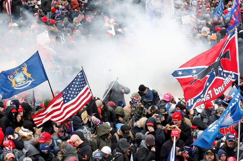 FILE PHOTO: Tear gas is released into a crowd of protesters during clashes with Capitol police at a rally to contest the certification of the 2020 U.S. presidential election results by the U.S. Congress, at the U.S. Capitol Building in Washington, U.S, January 6, 2021. REUTERS/Shannon Stapleton/File Photo