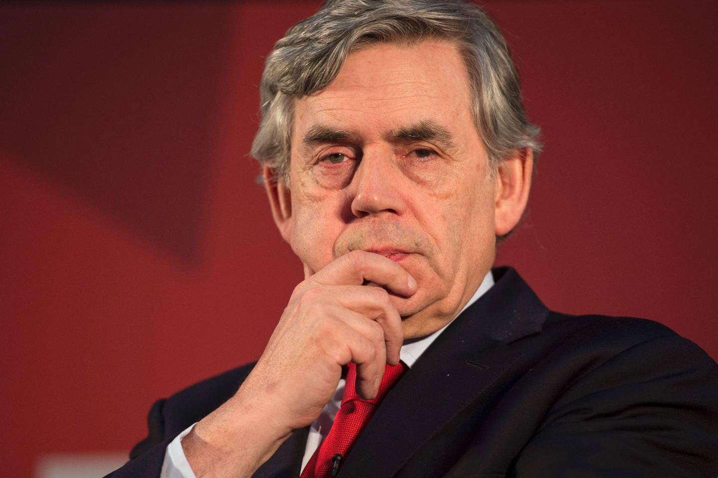 Former British Prime Minister Gordon Brown listens to speeches at a 'Labour IN' event promoting the case to remain in the EU, in The Union building of Manchester Metropolitan University in Manchester, northern England on June 16, 2016.  / AFP PHOTO / OLI SCARFF