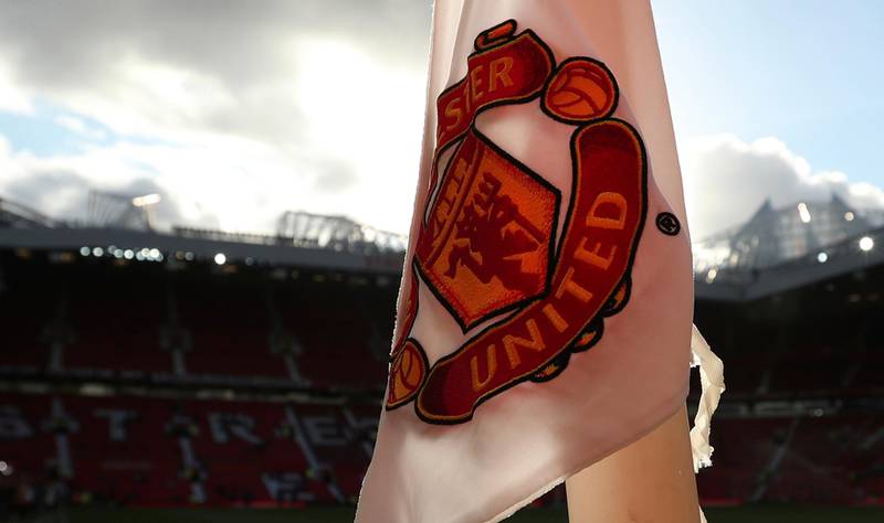 A corner flag with the logo of the Manchester United soccer team on it as the pitch is warted ahead of the English Premier League soccer match between Manchester United and Leicester City at Old Trafford, in Manchester, England, Friday, Aug. 10, 2018. (AP Photo/Jon Super)