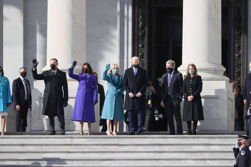 WASHINGTON, DC - JANUARY 20: (L-R) Doug Emhoff, U.S. Vice President-elect Kamala Harris, Jill Biden and President-elect Joe Biden wave as they arrive on the East Front of the U.S. Capitol for the inauguration on January 20, 2021 in Washington, DC. During today's inauguration ceremony Joe Biden becomes the 46th president of the United States.   Joe Raedle/Getty Images/AFP
== FOR NEWSPAPERS, INTERNET, TELCOS & TELEVISION USE ONLY ==