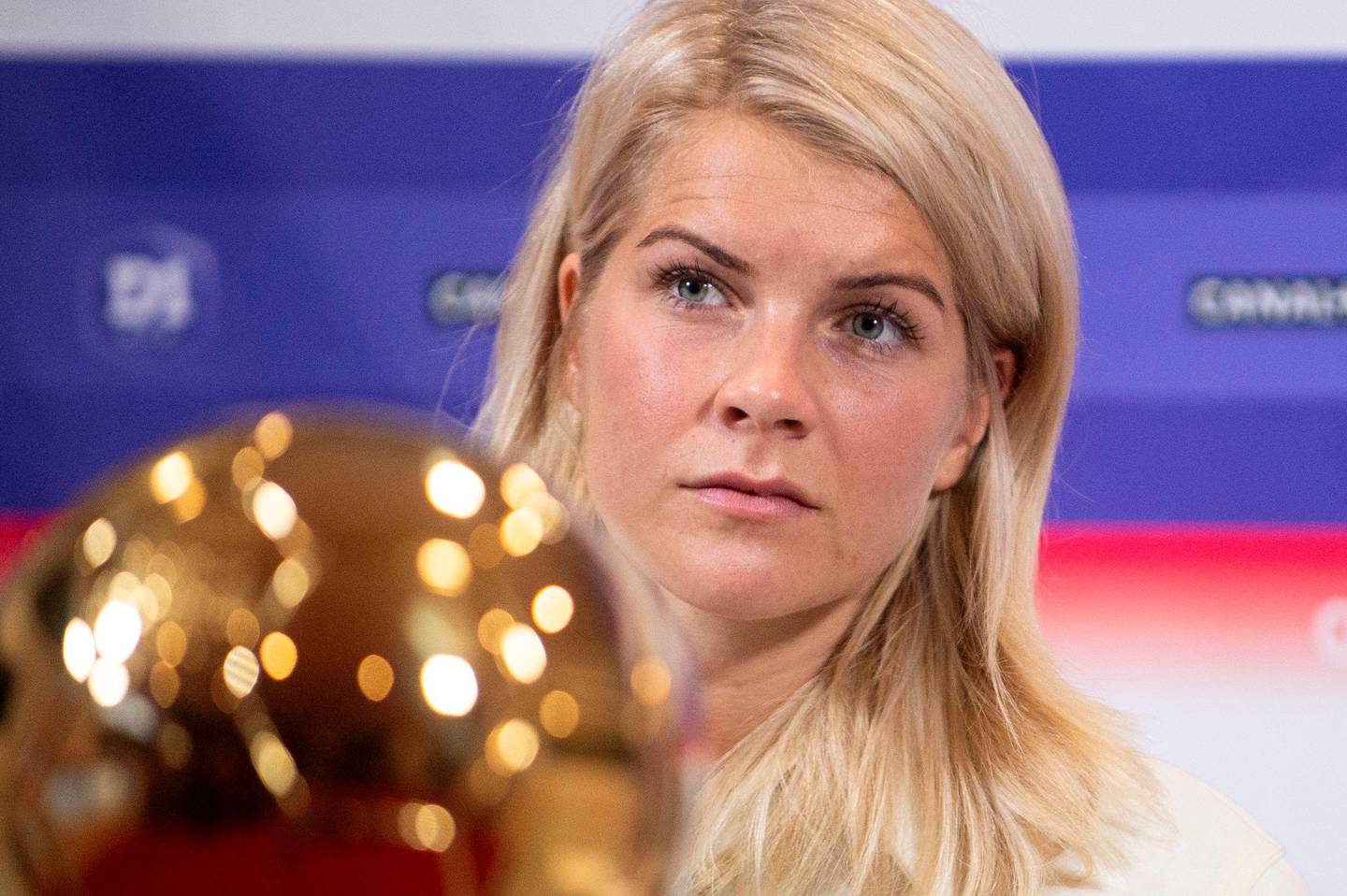 Lyon's Norwegian forward Ada Hegerberg, winner of 2018 Women's Ballon d'Or award for best player of the year, poses with the trophy during a press conference with Lyon's President at the Groupama training center in Lyon, central eastern France, on December 4, 2018. - Awarded the Golden Ball on December 3, Hegerberg is the first woman who won the price. (Photo by ROMAIN LAFABREGUE / AFP)