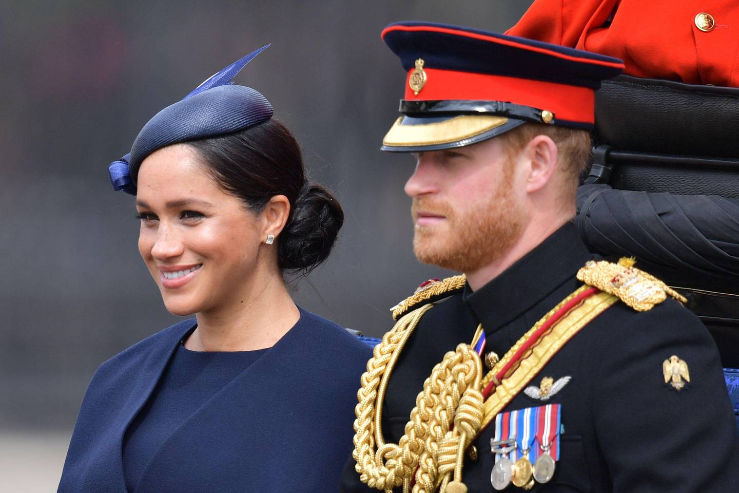 Britain's Meghan, Duchess of Sussex (L) and Britain's Prince Harry, Duke of Sussex (R) make their way in a horse drawn carriage to Horseguards parade ahead of the Queen's Birthday Parade, 'Trooping the Colour', in London on June 8, 2019. - The ceremony of Trooping the Colour is believed to have first been performed during the reign of King Charles II. Since 1748, the Trooping of the Colour has marked the official birthday of the British Sovereign. Over 1400 parading soldiers, almost 300 horses and 400 musicians take part in the event. (Photo by Daniel LEAL-OLIVAS / AFP)
